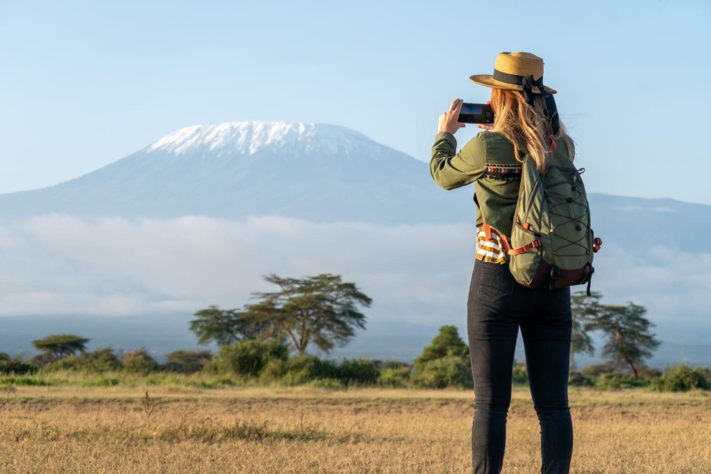 Solo female traveler enjoying a safari in Kenya.