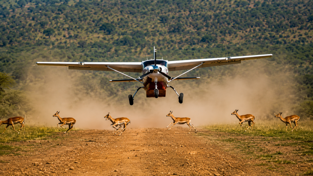 Safari vehicle and small aircraft used for travel between Kenyan safari destinations